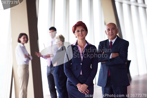 Image of diverse business people group with redhair  woman in front