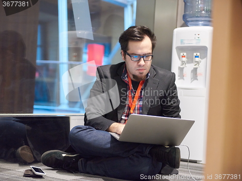 Image of young business man in rush prepare conference presentation on la