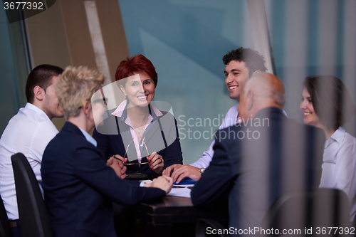 Image of business people group on meeting at modern bright office