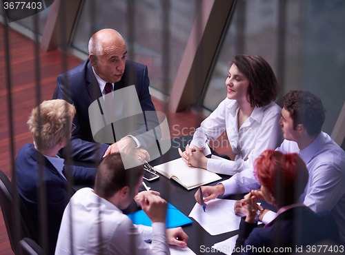 Image of business people group on meeting at modern bright office