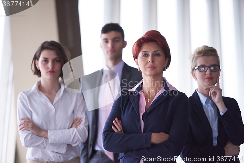 Image of diverse business people group with redhair  woman in front