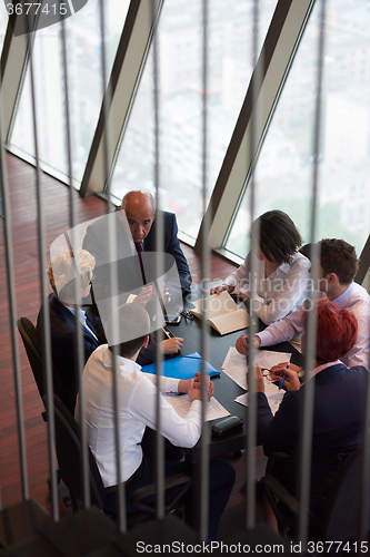 Image of business people group on meeting at modern bright office