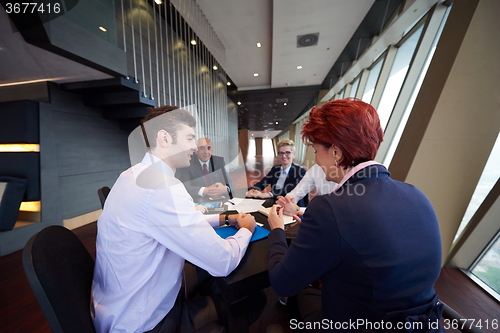 Image of business people group on meeting at modern bright office