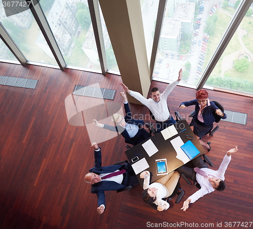 Image of top view of business people group throwing dociments in air