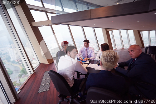 Image of business people group on meeting at modern bright office