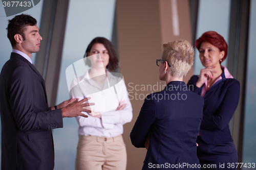 Image of business people group on meeting at modern bright office