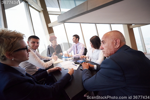 Image of business people group on meeting at modern bright office