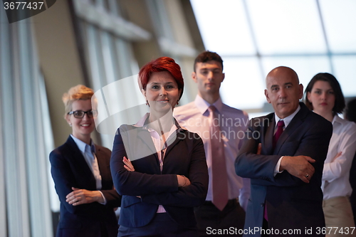 Image of diverse business people group with redhair  woman in front