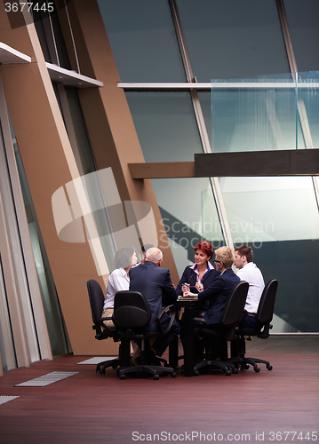 Image of business people group on meeting at modern bright office