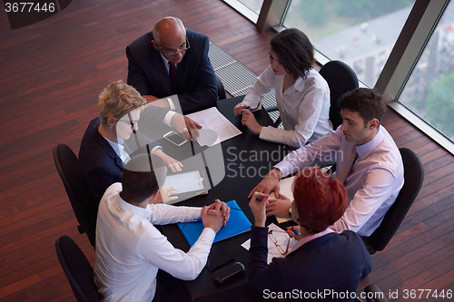 Image of business people group on meeting at modern bright office