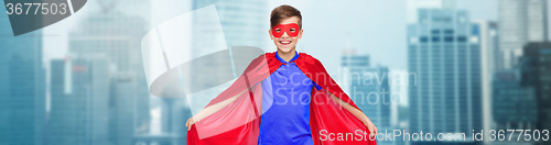 Image of boy in red super hero cape and mask