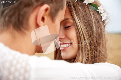 Image of happy smiling young hippie couple outdoors