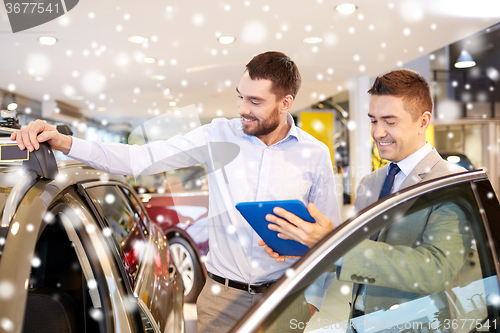 Image of happy man with car dealer in auto show or salon