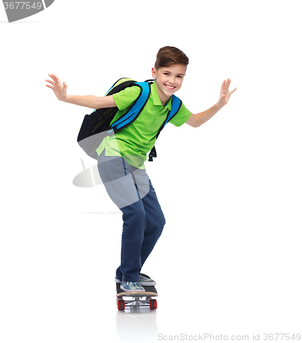 Image of happy student boy with backpack and skateboard