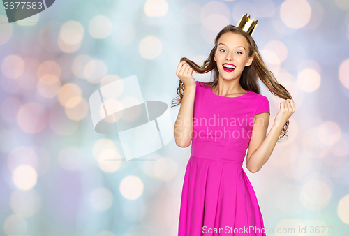 Image of happy young woman or teen girl in pink dress