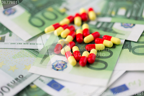 Image of medical pills or drugs and euro cash money