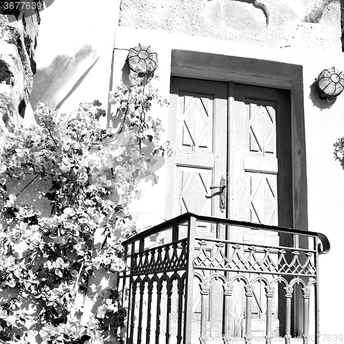 Image of blue door in antique village santorini greece europe and    whit