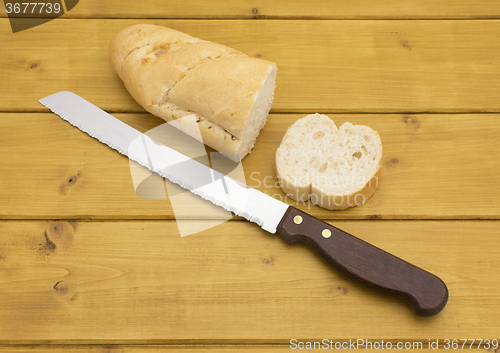 Image of Portion of baguette with a slice cut off