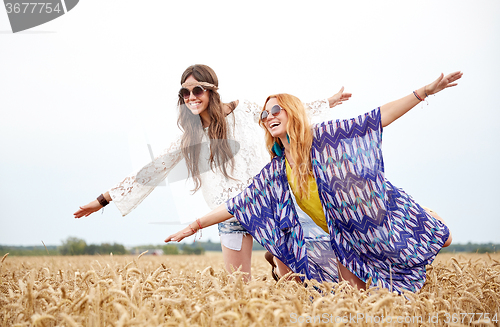 Image of happy hippie women having fun on cereal field