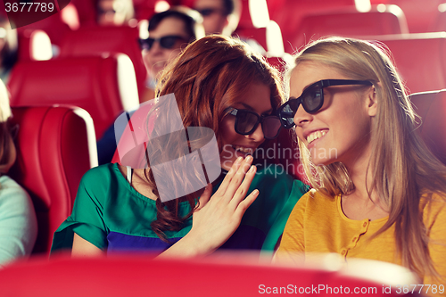 Image of happy friends watching movie in 3d theater