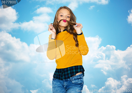 Image of happy young woman or teen girl in casual clothes