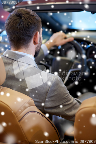 Image of close up of man in cabrio car at auto show