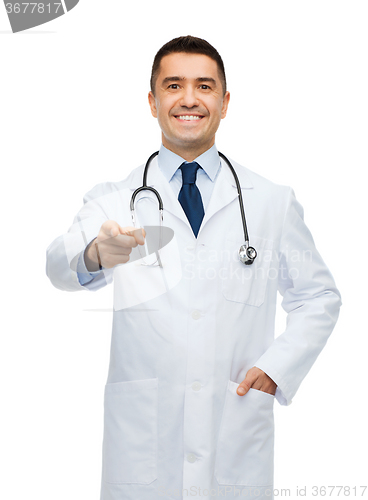 Image of smiling male doctor in white coat pointing at you