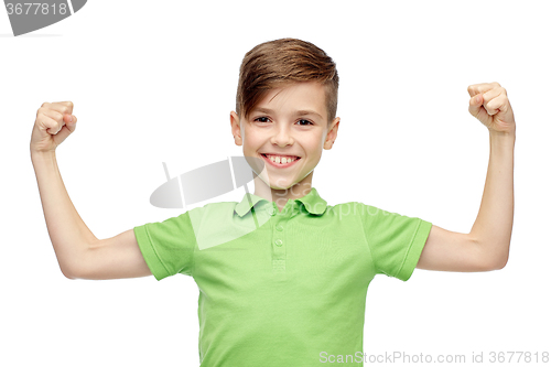 Image of happy boy in polo t-shirt showing strong fists