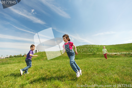 Image of group of happy kids running outdoors