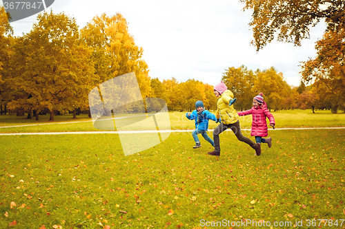 Image of group of happy little kids running outdoors