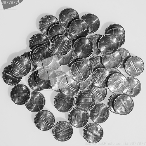 Image of Black and white Dollar coins 1 cent