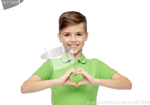 Image of happy boy showing heart hand sign