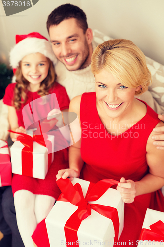 Image of happy family opening gift boxes