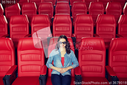 Image of young woman watching movie in 3d theater