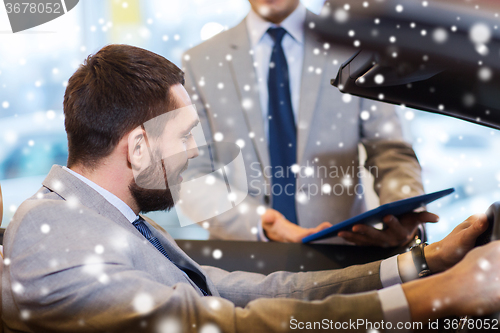 Image of happy man with car dealer in auto show or salon