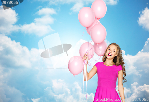 Image of happy young woman or teen girl in pink dress