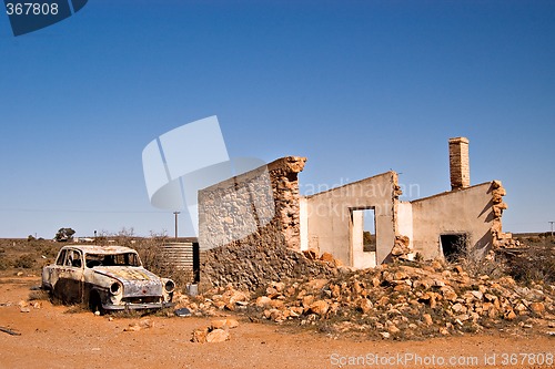 Image of old car and ruins