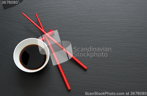 Image of Soy sauce with chopsticks