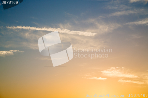 Image of in the red blue sky cloud and  orange color