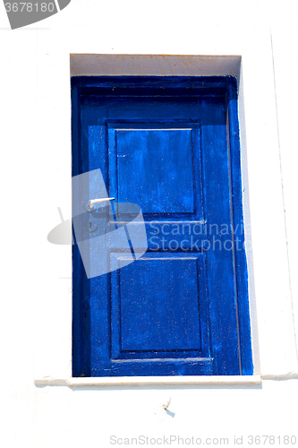 Image of blue door in antique village  