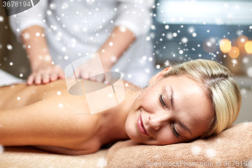 Image of close up of woman having back massage in spa