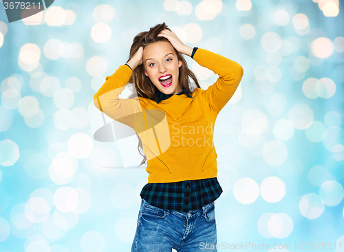 Image of happy young woman or teen girl in casual clothes