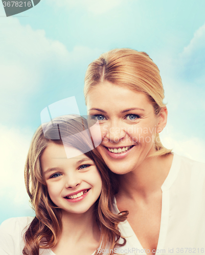 Image of smiling mother and little girl