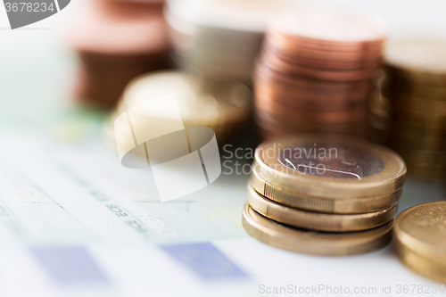 Image of close up of euro paper money and coins on table