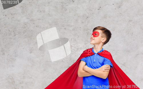 Image of boy in red super hero cape and mask