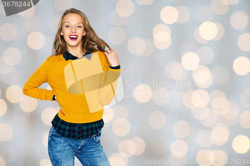 Image of happy young woman or teen girl in casual clothes