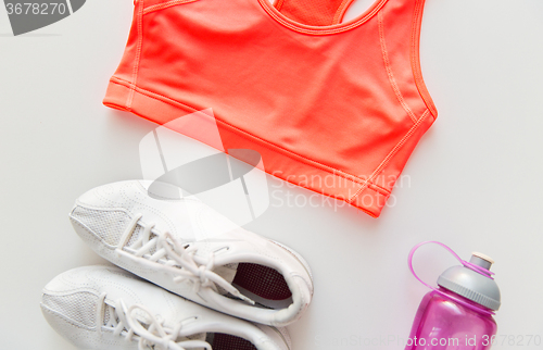 Image of close up of female sports clothing and bottle set