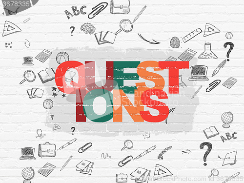 Image of Learning concept: Questions? on wall background