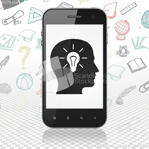 Image of Education concept: Smartphone with Head With Light Bulb on display