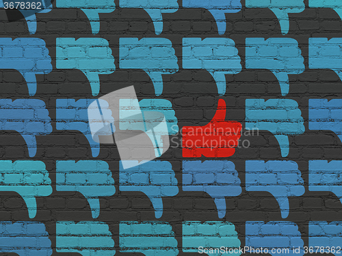 Image of Social network concept: thumb up icon on wall background